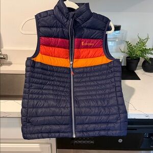 Cotopaxi Navy Vest with Red and Orange Accents